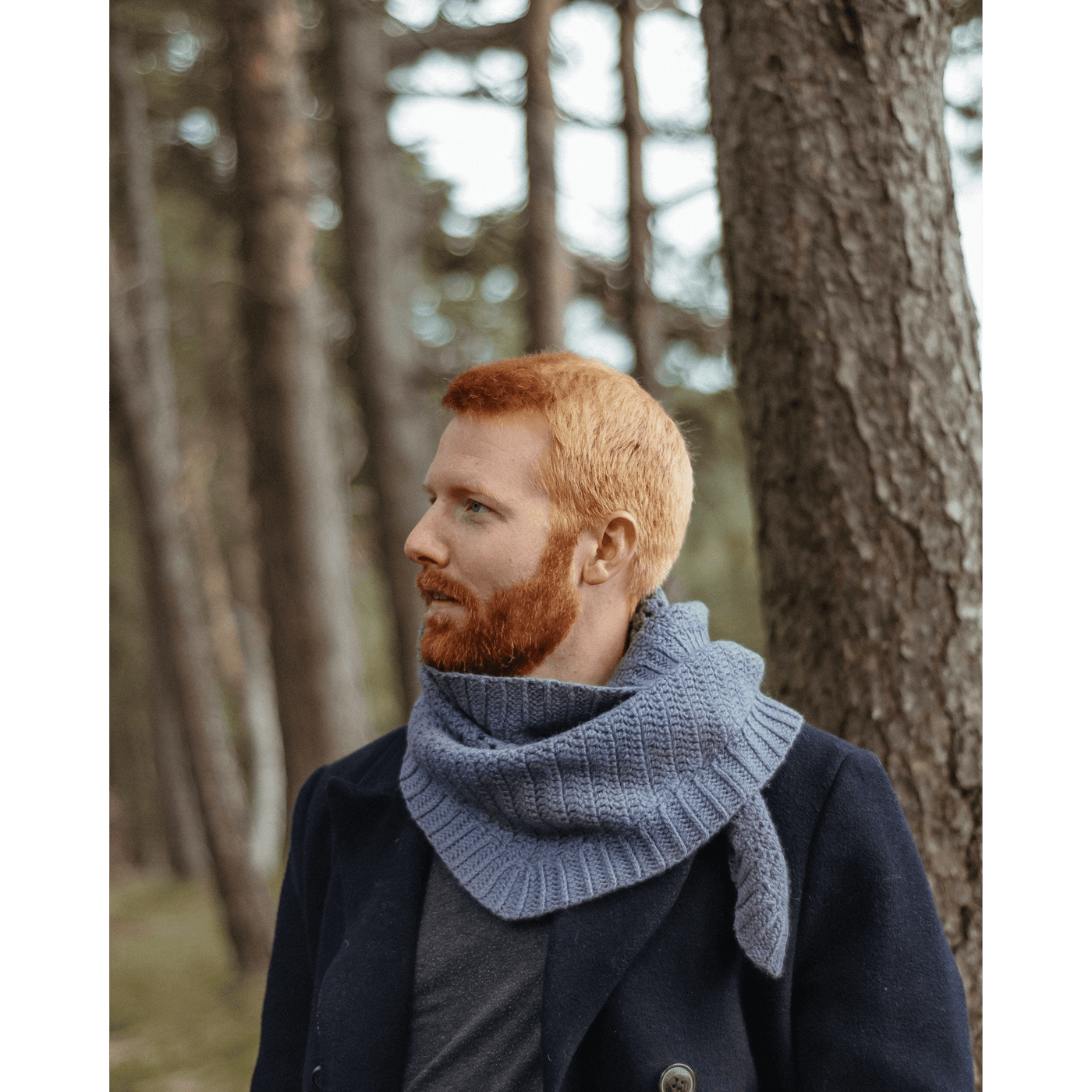 The Woolly Thistle Moorit Magazine - Issue 1 image from magazine showing man wearing knitted blue scarf