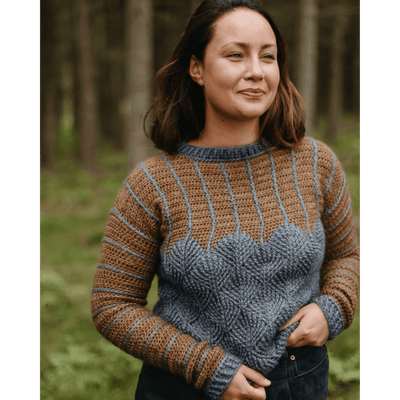 The Woolly Thistle Moorit Magazine - Issue 1 image from magazine showing woman wearing brown and blue knitted sweater