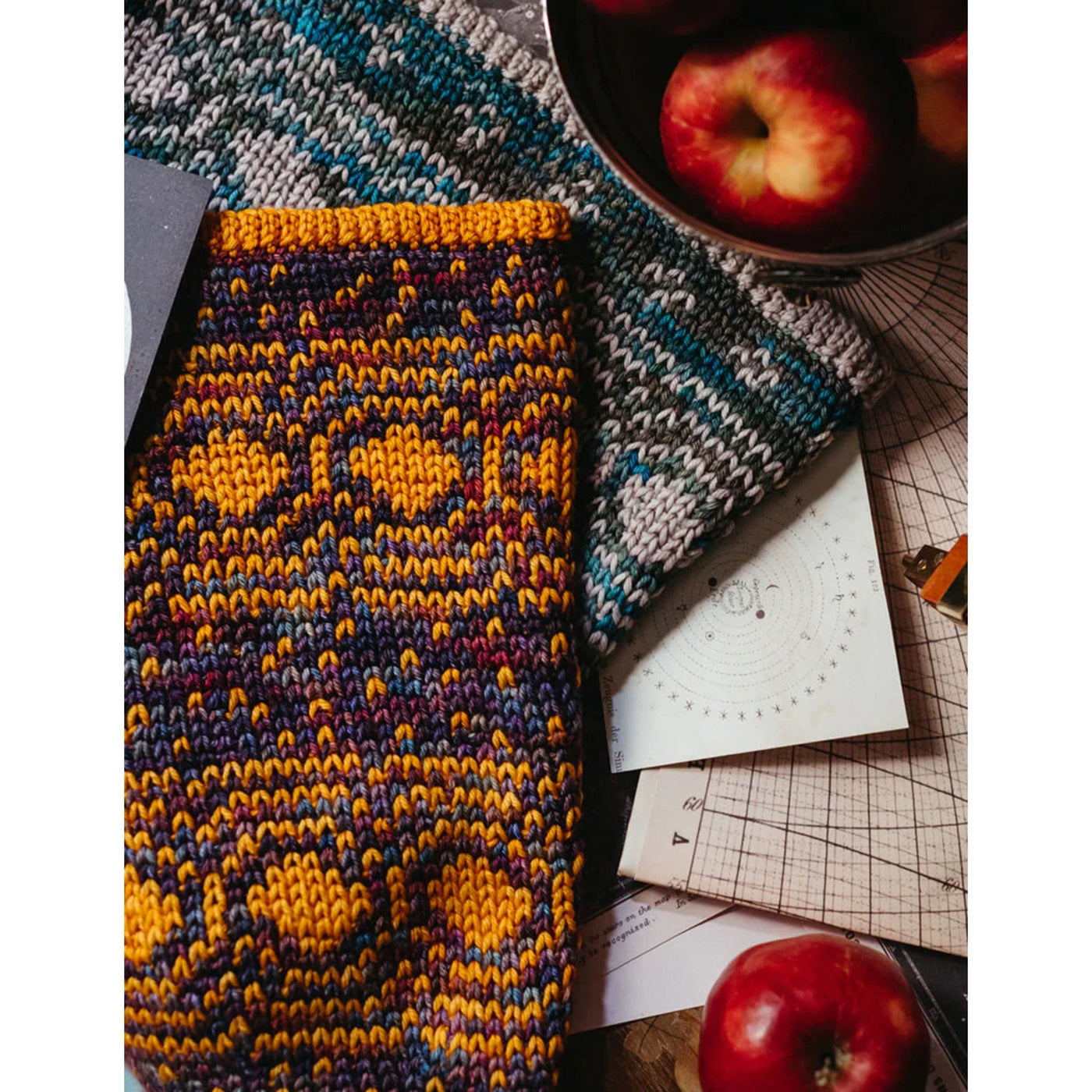 Colorful cowls (pattern Cosmic Cowls) lying on workspace- pattern found in Moorit Magazine Issue 3 - Cosmic.