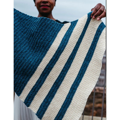 Woman holding Star Trail wrap - pattern found in Moorit Magazine Issue 3 - Cosmic.