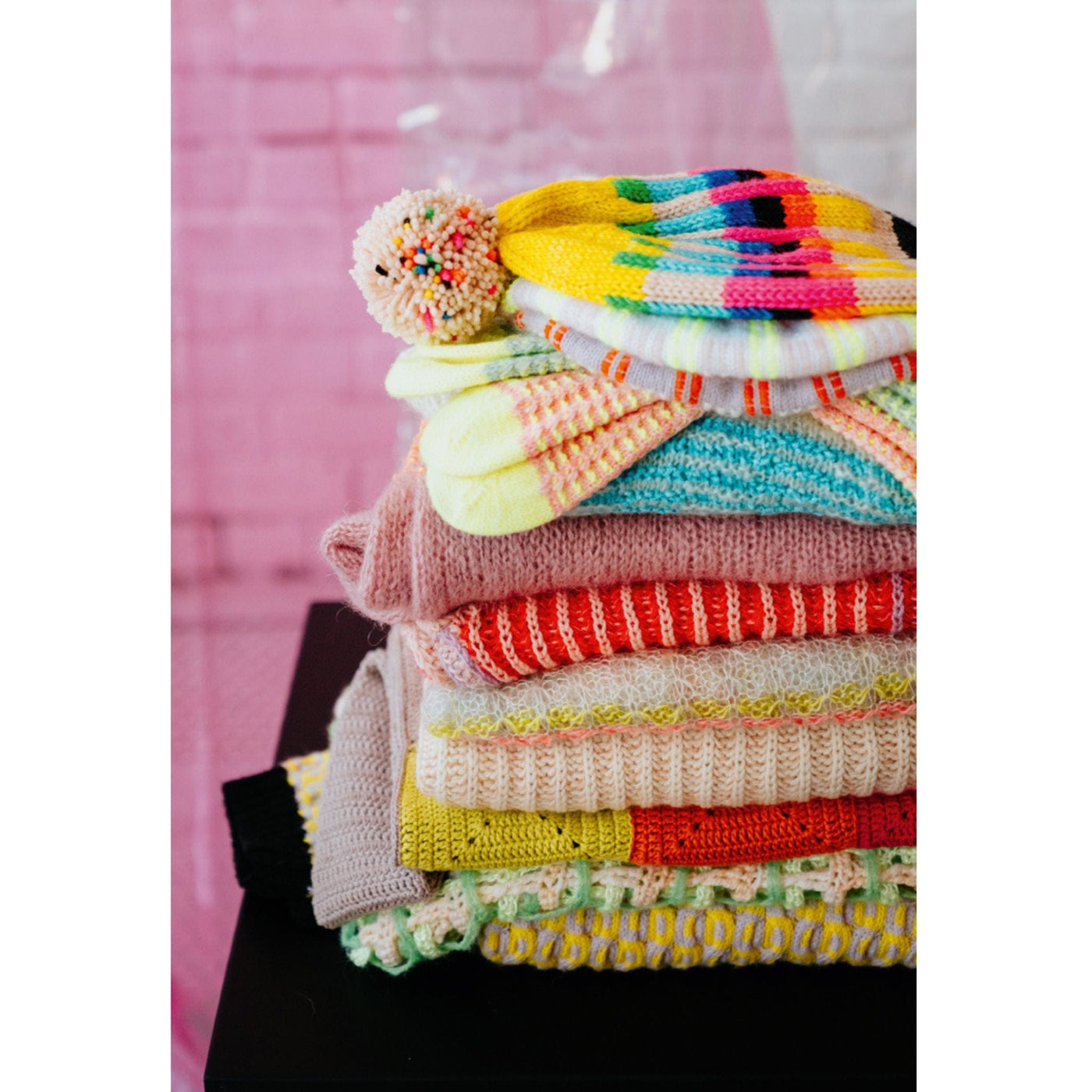 A beautiful pile of knitwear and crochet items featured in Pom Pom Issue 44. 