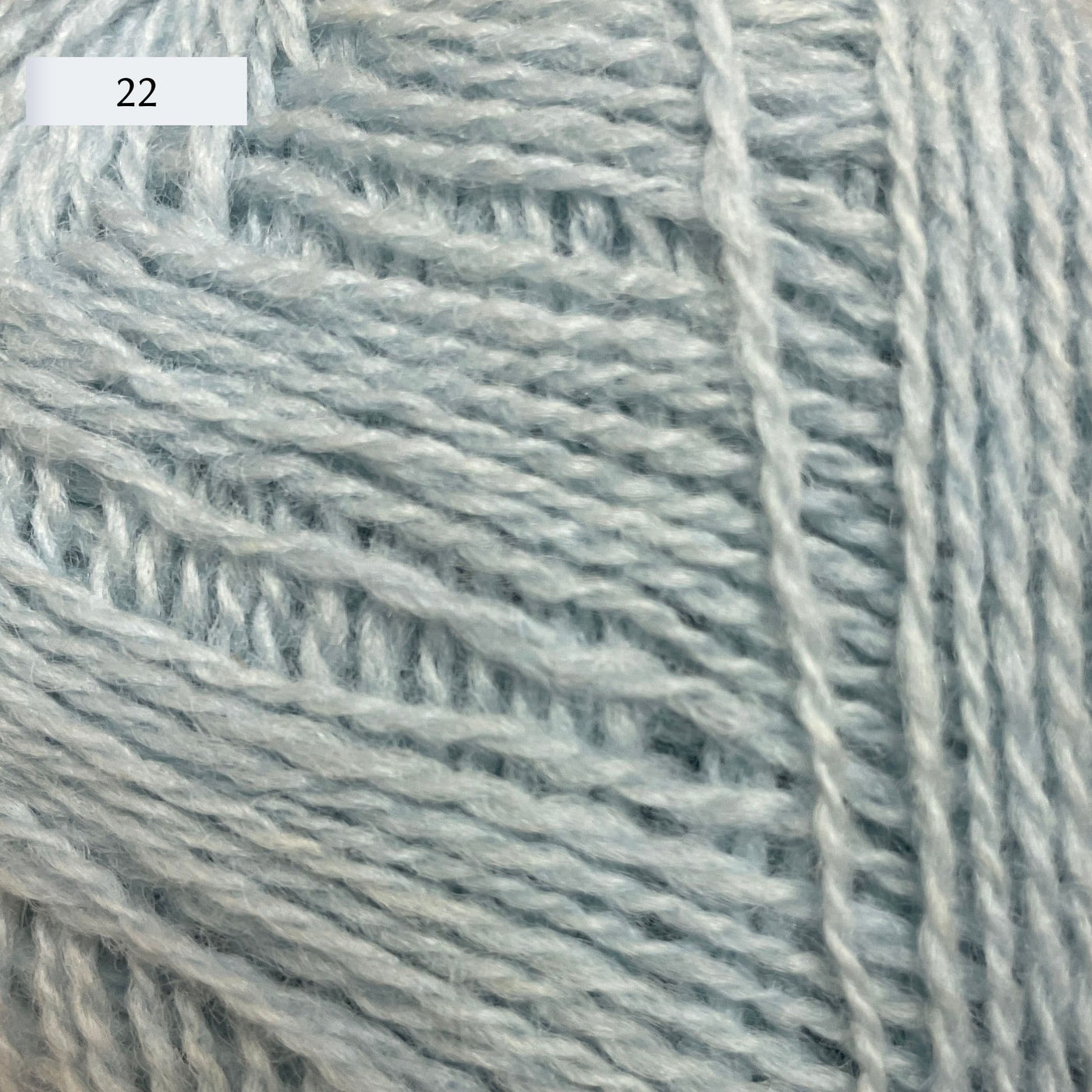 Rauma Lamullgarn, a fingering weight yarn, in color 22, a very light ice blue