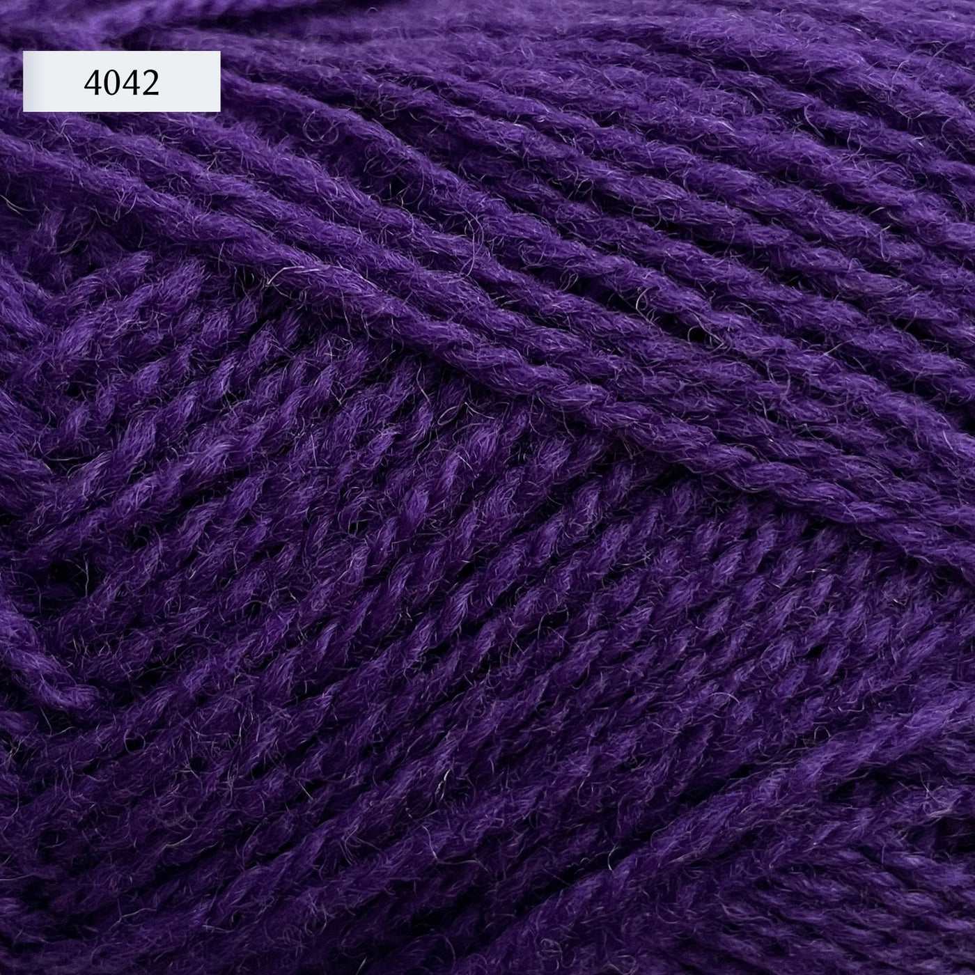 Rauma Finullgarn, a fingering/sport weight yarn, in color 4042, a royal purple