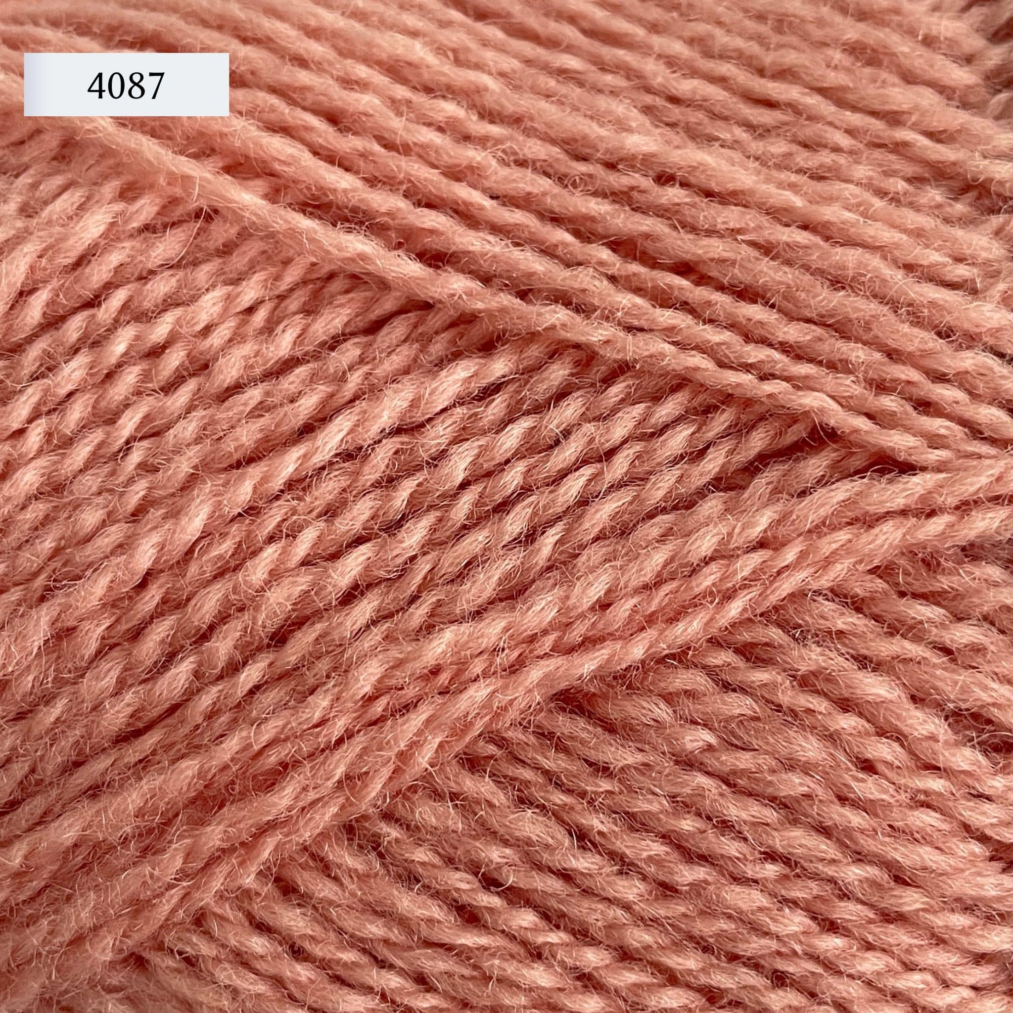Rauma Finullgarn, a fingering/sport weight yarn, in color 4087, a light pink