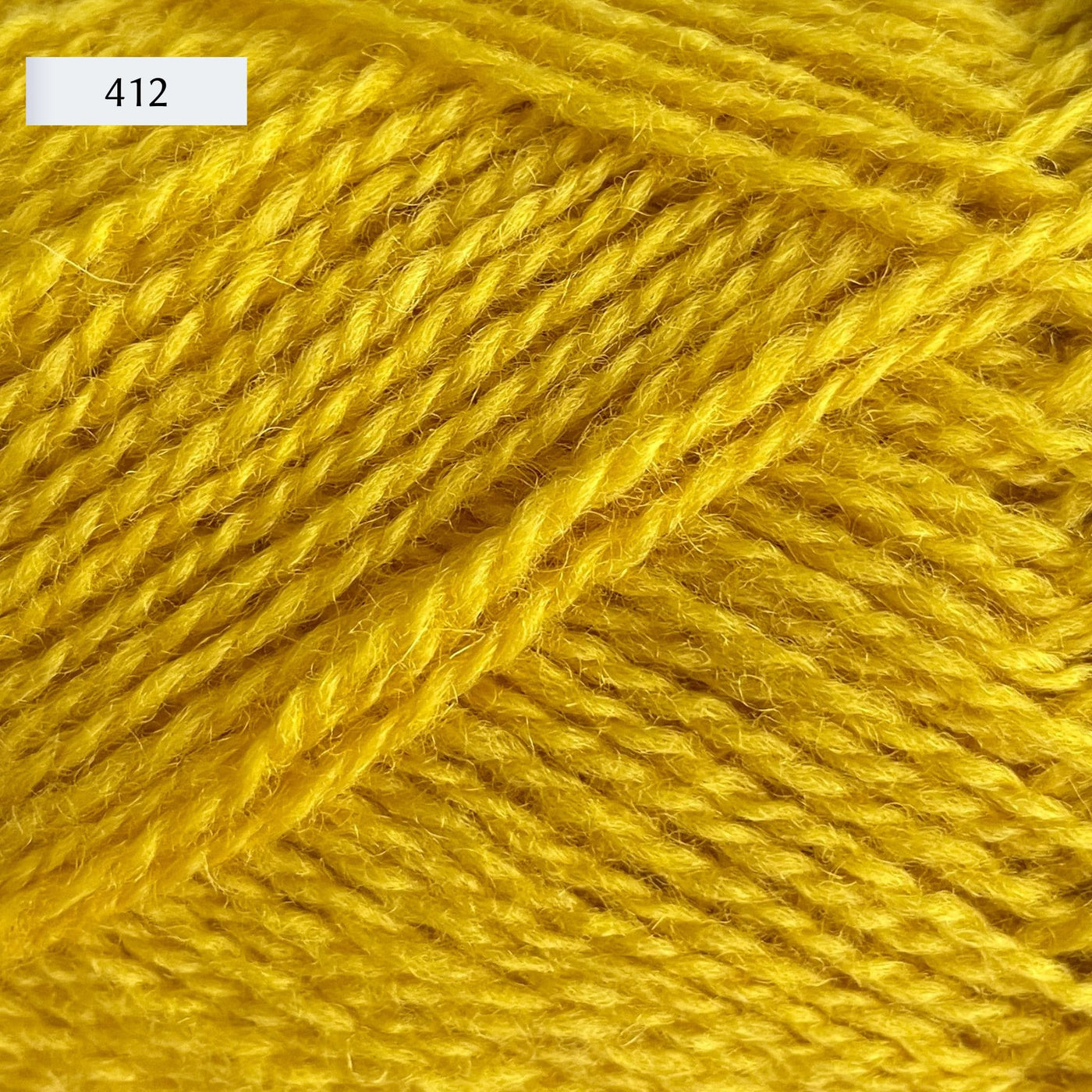 Rauma Finullgarn, a fingering/sport weight yarn, in color 412, a primary yellow