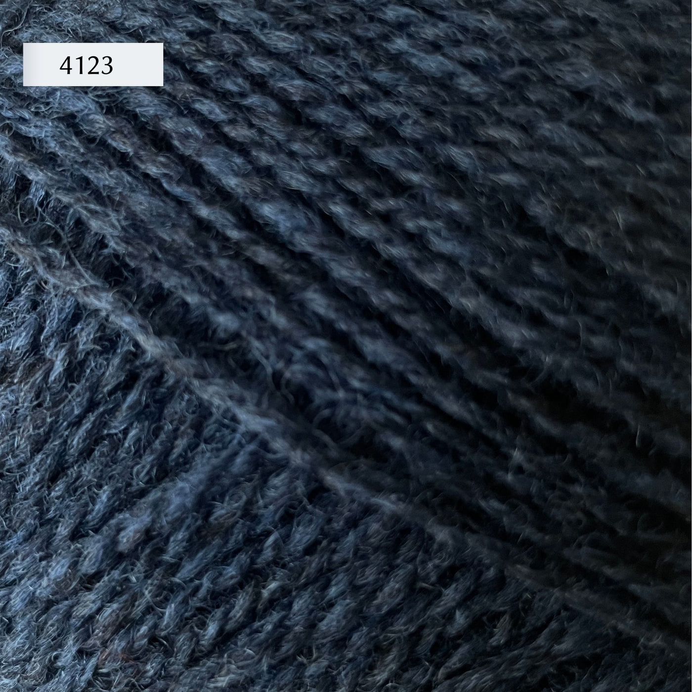 Rauma Finullgarn, a fingering/sport weight yarn, in color 4123, a heathered dark petrol blue