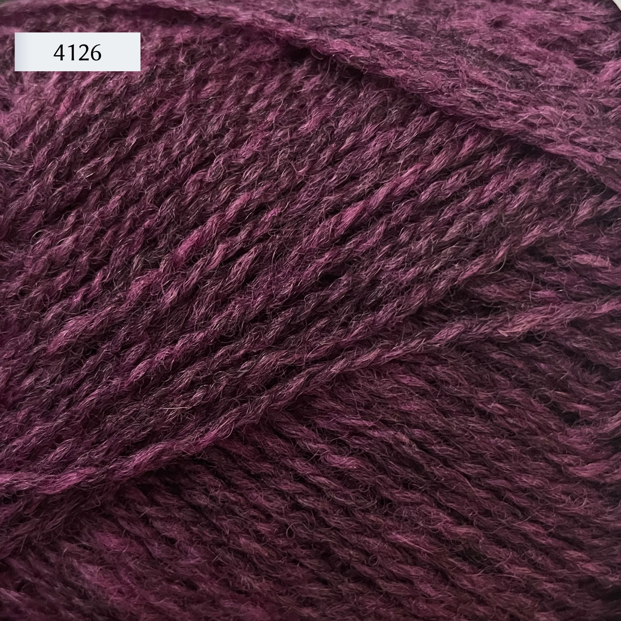 Rauma Finullgarn, a fingering/sport weight yarn, in color 4126, a heathered plum purple