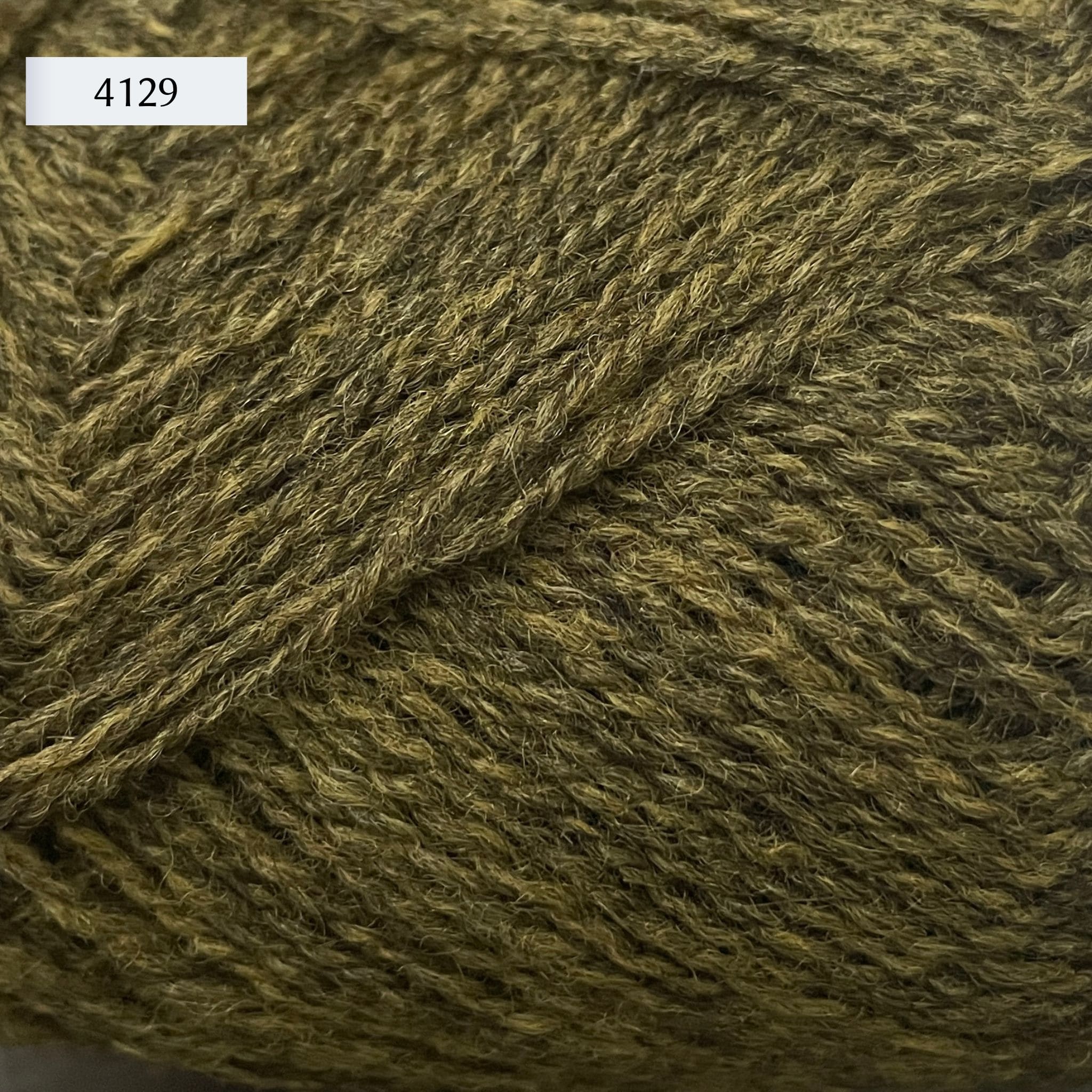 Rauma Finullgarn, a fingering/sport weight yarn, in color 4129, a heathered olive green