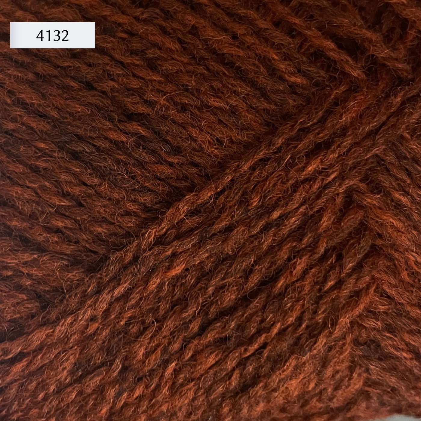 Rauma Finullgarn, a fingering/sport weight yarn, in color 4132, a heathered copper