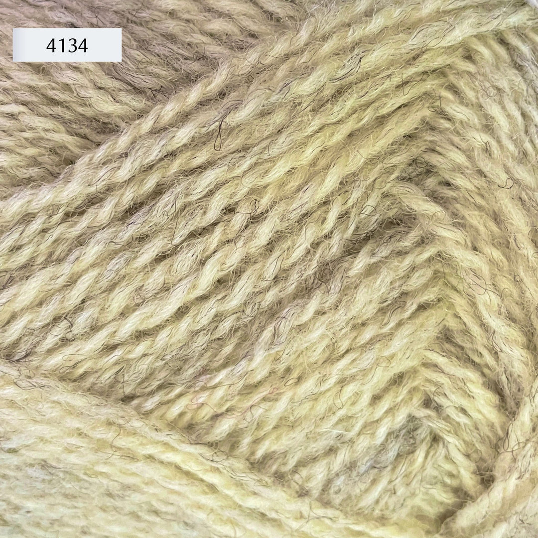 Rauma Finullgarn, a fingering/sport weight yarn, in color 4134, a heathered very light yellow/green