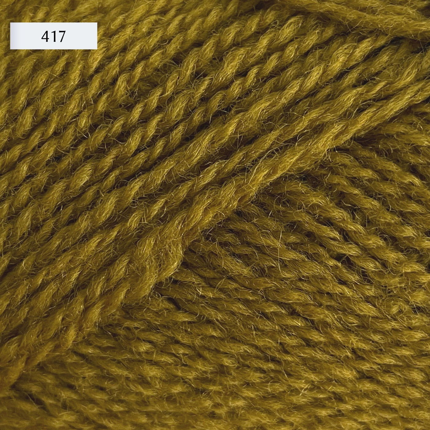 Rauma Finullgarn, a fingering/sport weight yarn, in color 417, a camo green-yellow
