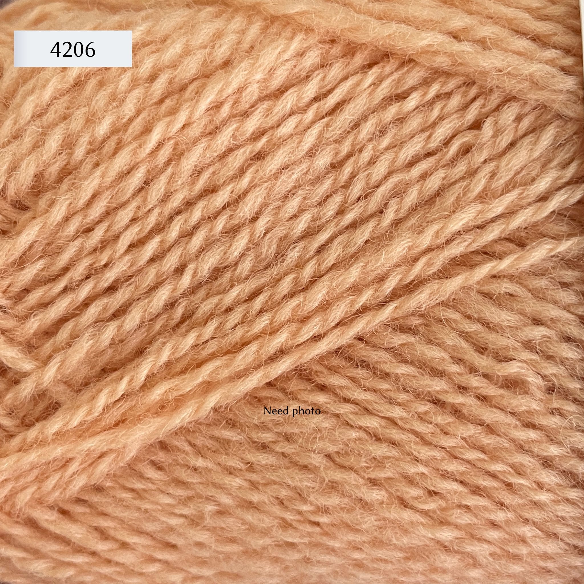 Rauma Finullgarn, a fingering/sport weight yarn, in color 4206, a light peach