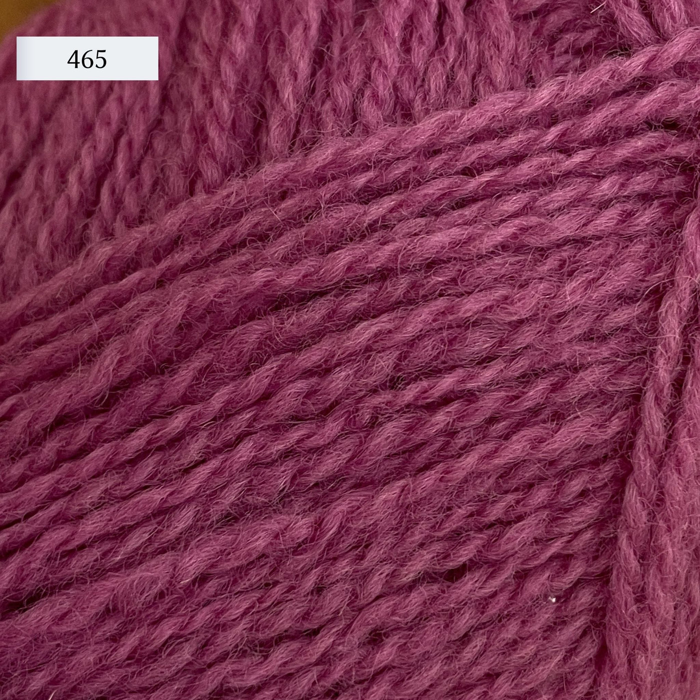 Rauma Finullgarn, a fingering/sport weight yarn, in color 465, a medium pink.