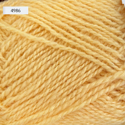 Rauma Finullgarn, a fingering/sport weight yarn, in color 4986, a light butter yellow