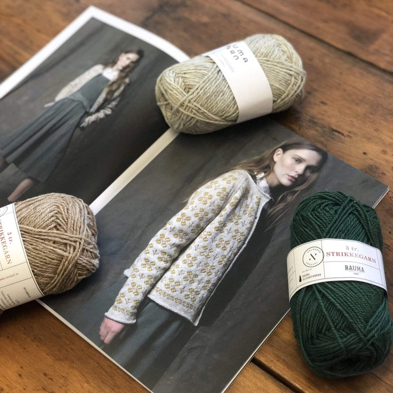 The Woolly Thistle Annajakke Cardigan 288-2 in Rauma Strikkegarn and 3 balls of Rauma Strikkengarn yarn in light beige, beige, and dark green