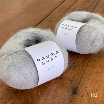Two balls of Rauma Plum, a laceweight mohair blend yarn, in color 192, a bone grey