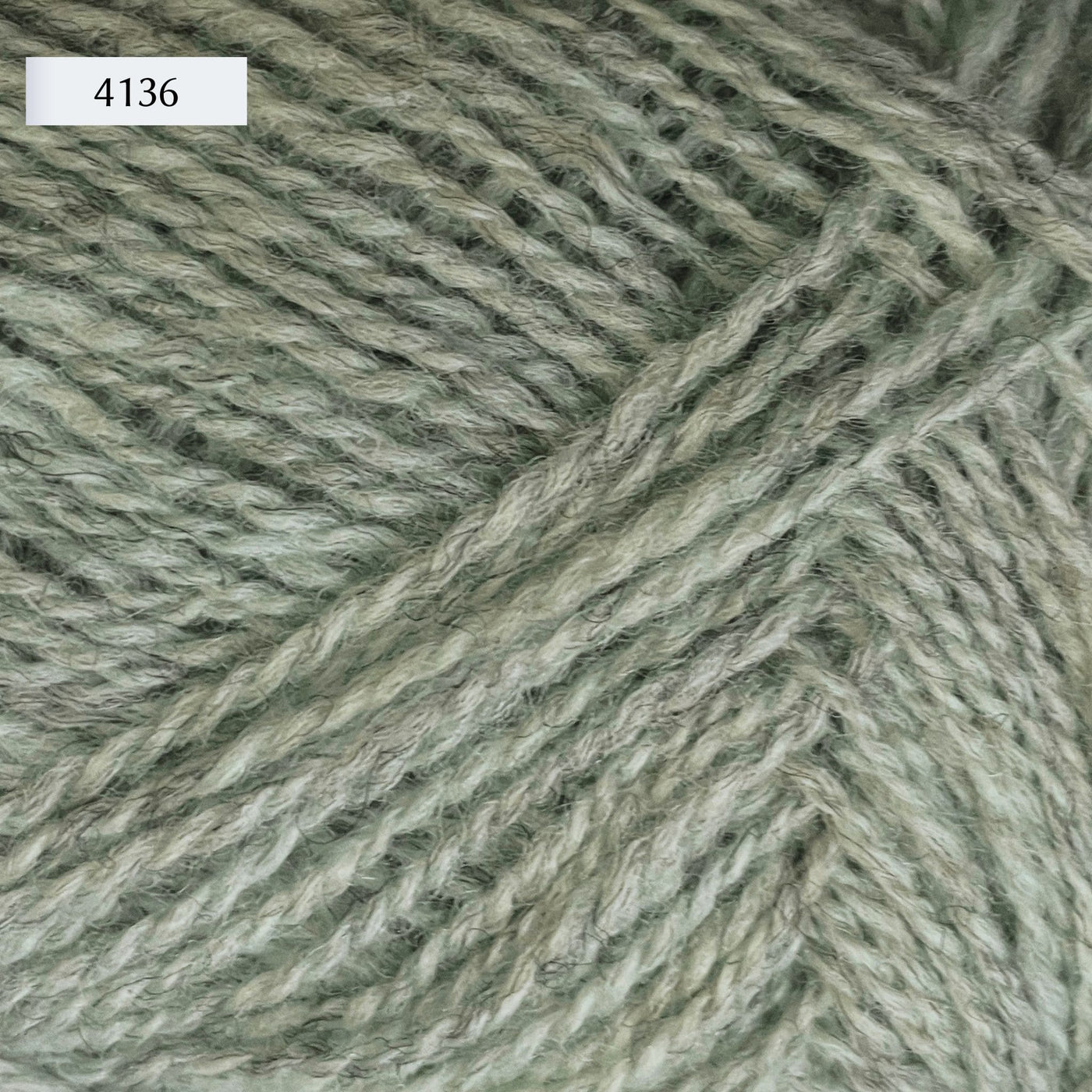 Rauma Finullgarn, a fingering/sport weight yarn, in color 4136, a heathered light mint green
