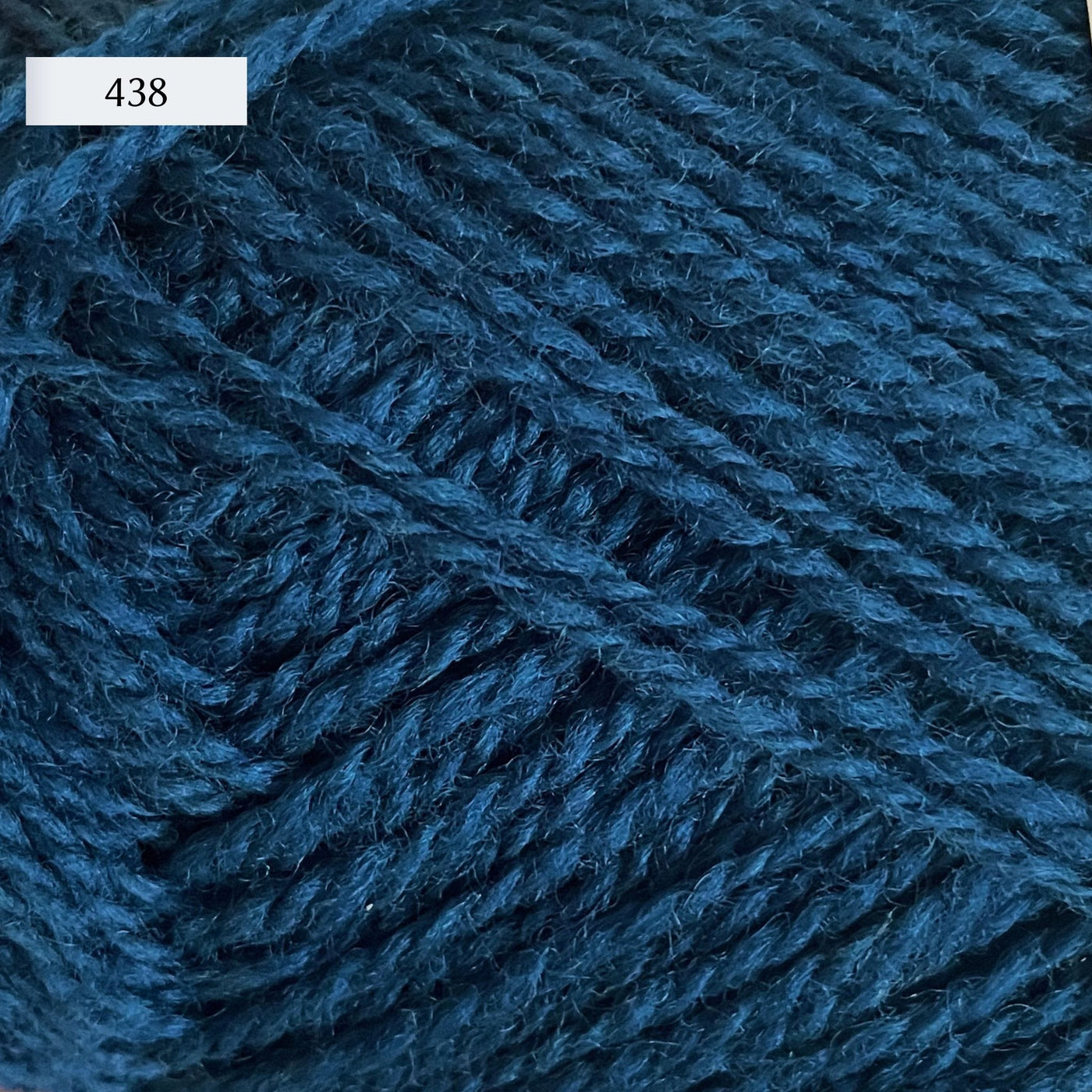 Rauma Finullgarn, a fingering/sport weight yarn, in color 438, a medium greenish blue