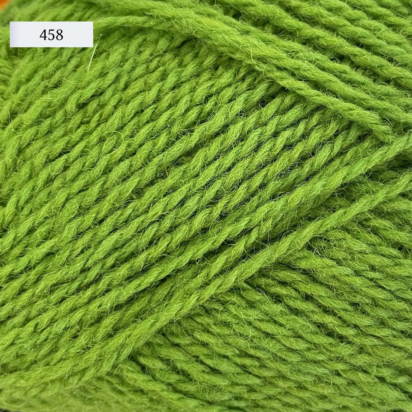 Rauma Finullgarn, a fingering/sport weight yarn, in color 458, a medium green