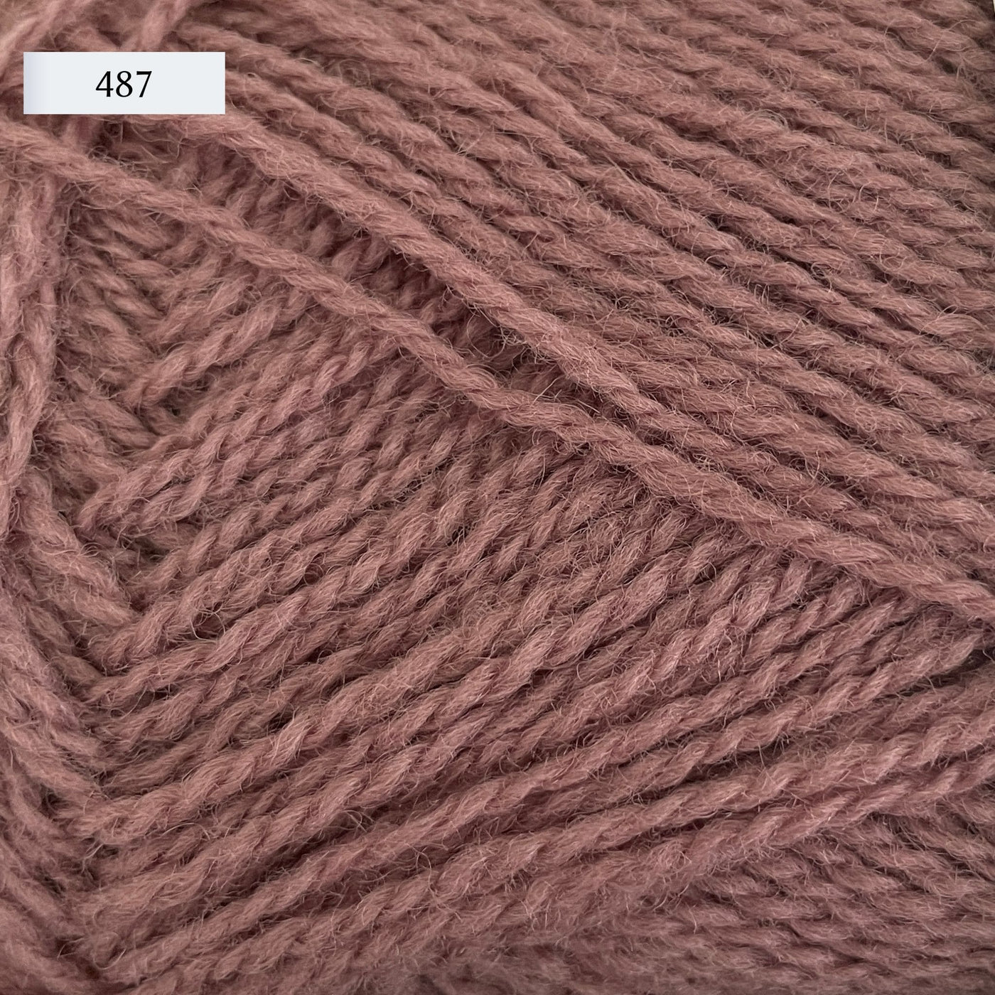 Rauma Finullgarn, a fingering/sport weight yarn, in color 487, a dusty mauve