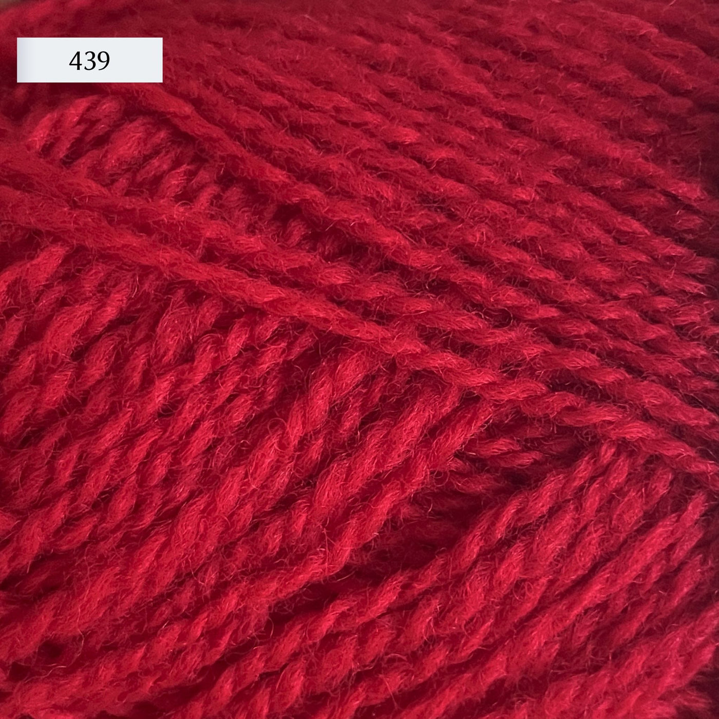 Rauma Finullgarn, a fingering/sport weight yarn, in color 439, a rich pink-red