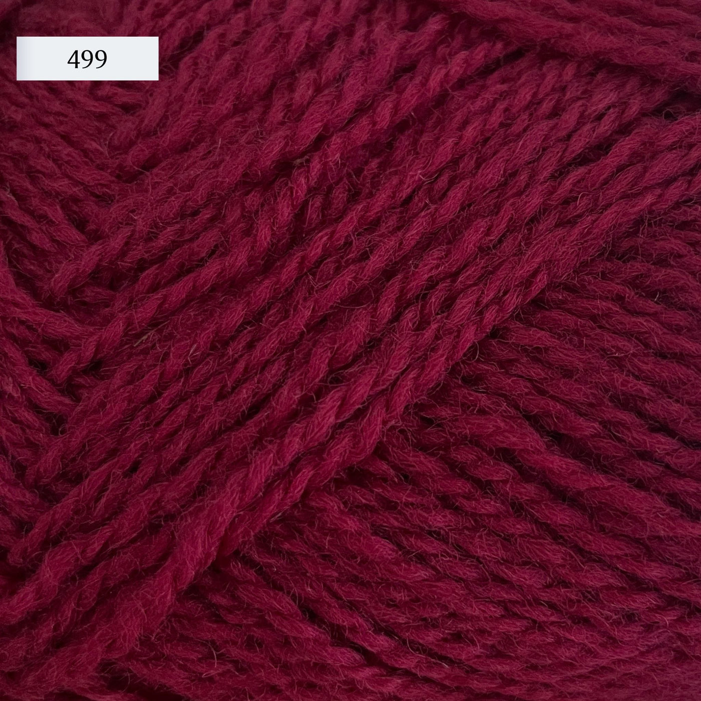 Rauma Finullgarn, a fingering/sport weight yarn, in color 499, a red-burgundy