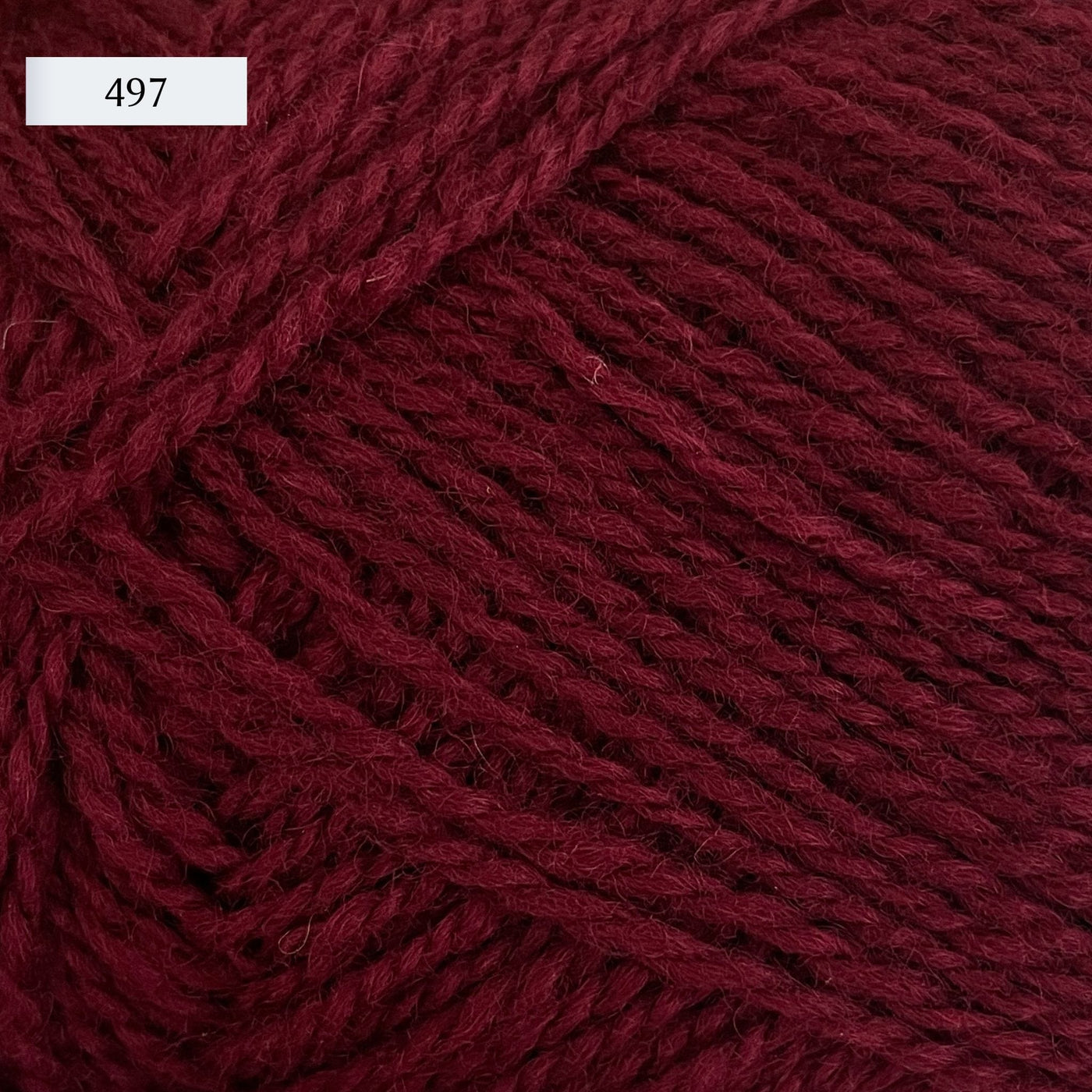 Rauma Finullgarn, a fingering/sport weight yarn, in color 497, a maroon