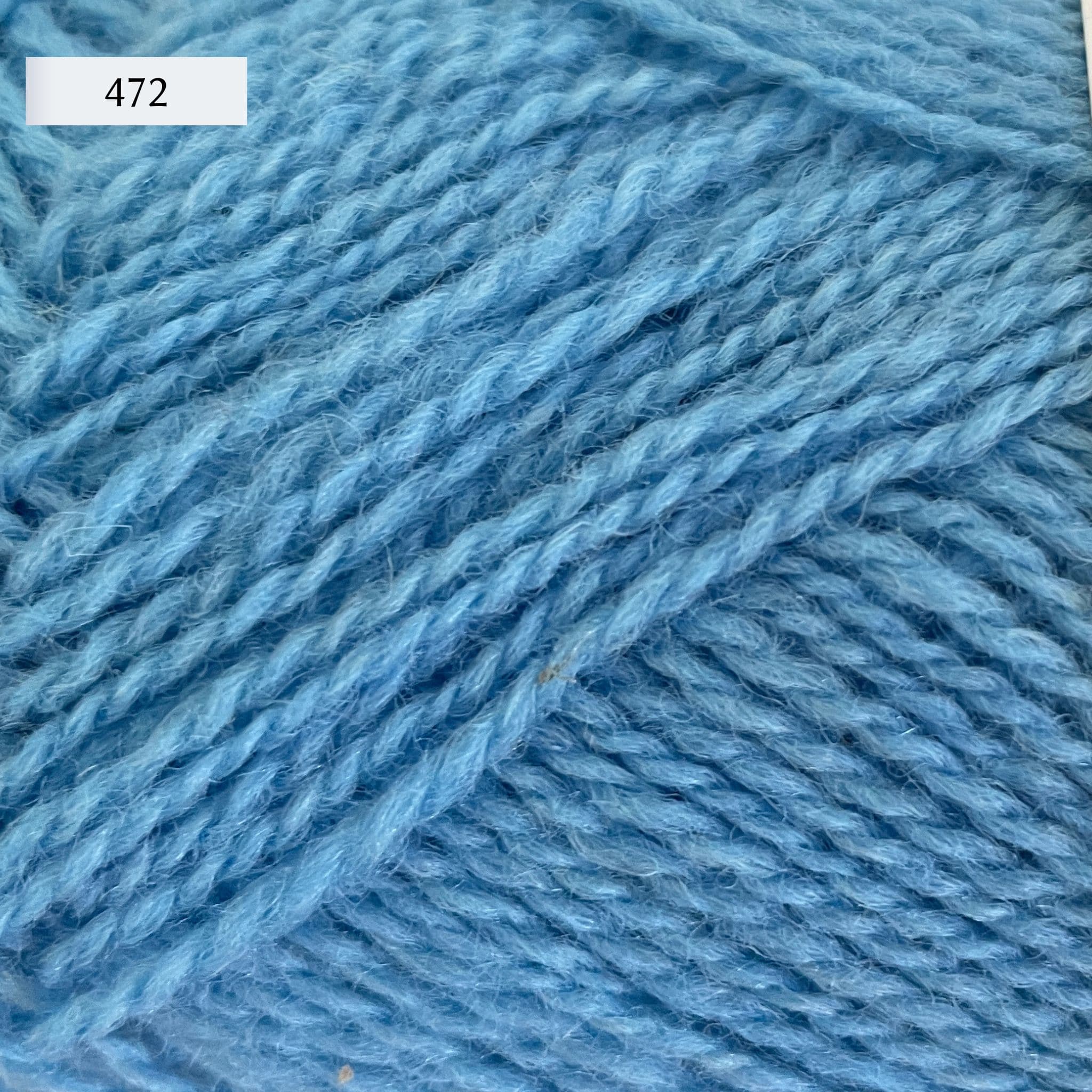 Rauma Finullgarn, a fingering/sport weight yarn, in color 472, a light cornflower blue