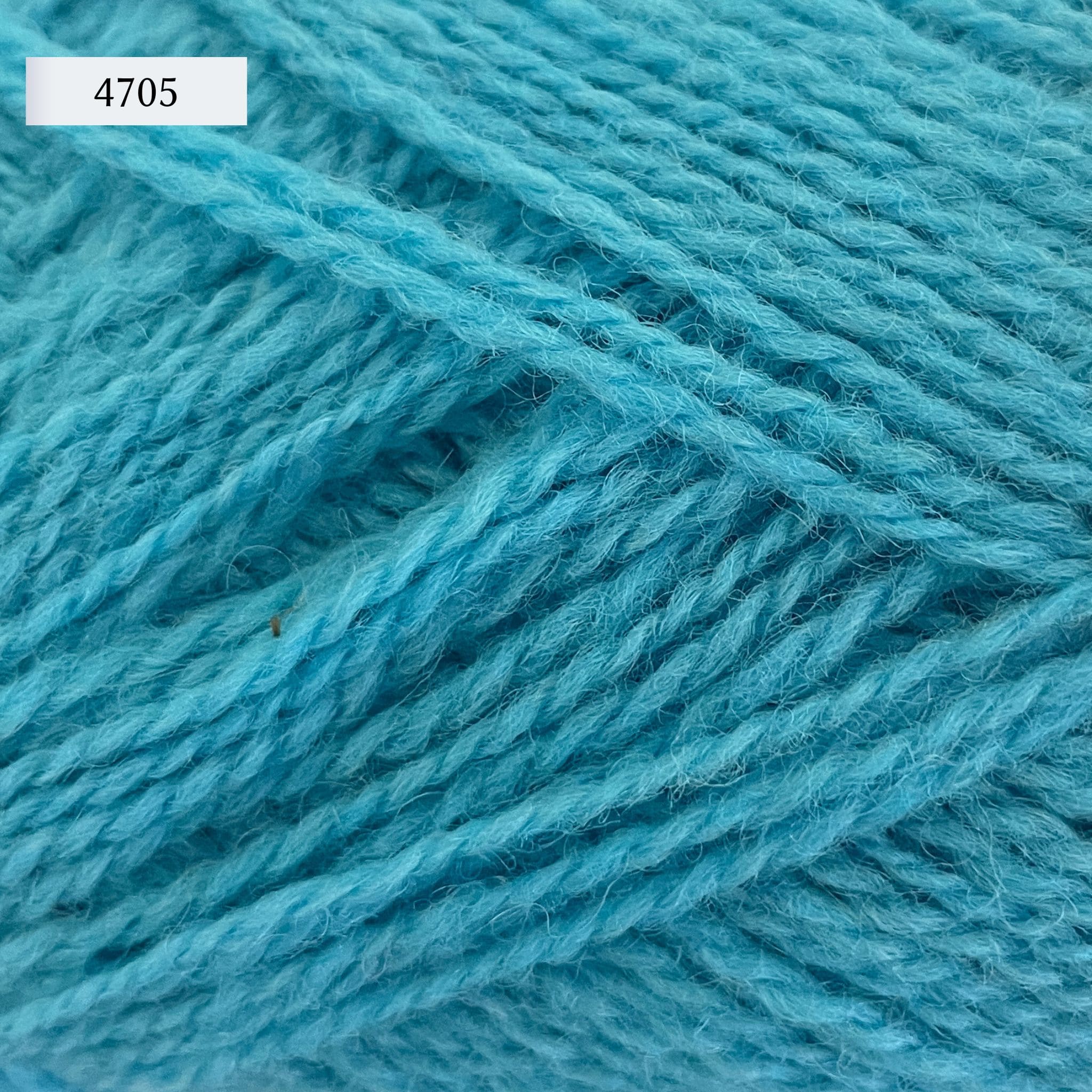 Rauma Finullgarn, a fingering/sport weight yarn, in color 472, a light turquoise blue