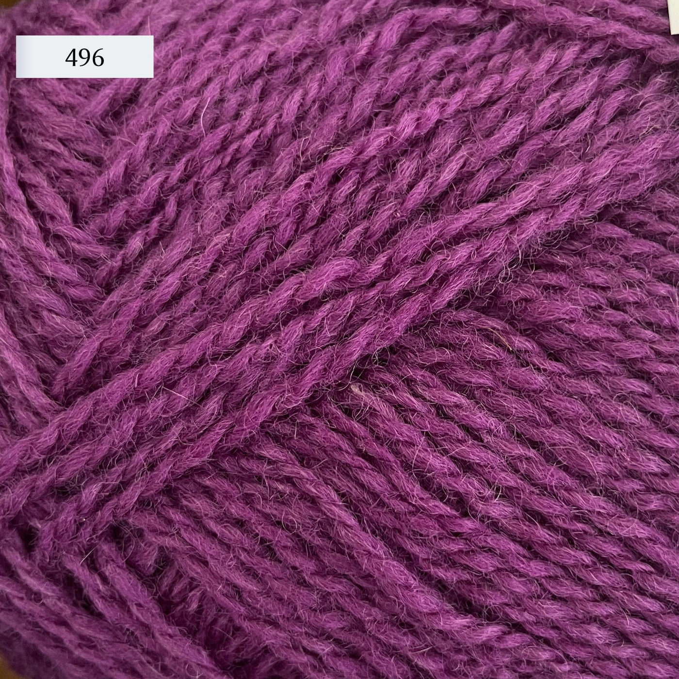 Rauma Finullgarn, a fingering/sport weight yarn, in color 496, a medium raspberry purple