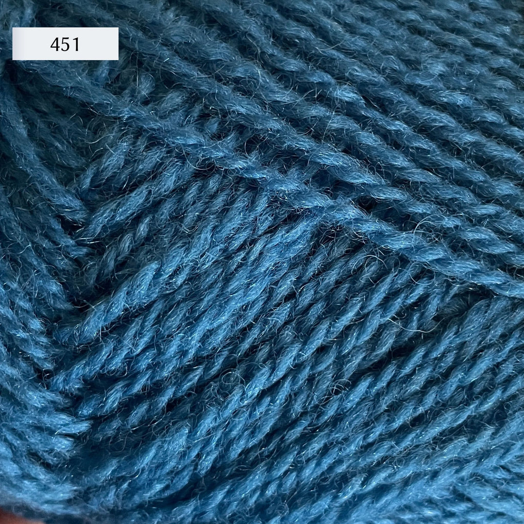 Rauma Finullgarn, a fingering/sport weight yarn, in color 451, a deep petrol blue