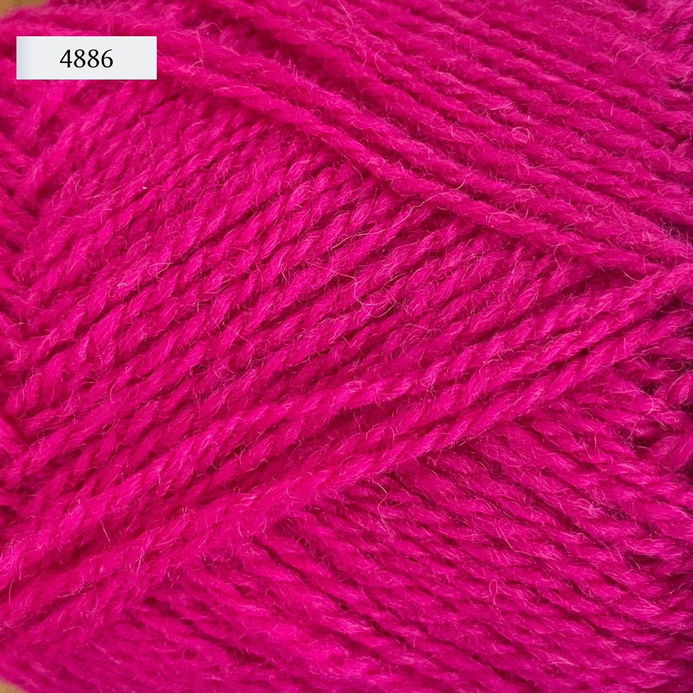 Rauma Finullgarn, a fingering/sport weight yarn, in color 4886, a bright fuschia