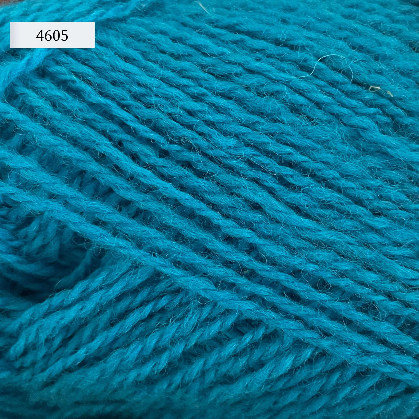 Rauma Finullgarn, a fingering/sport weight yarn, in color 4605, a medium turquoise blue