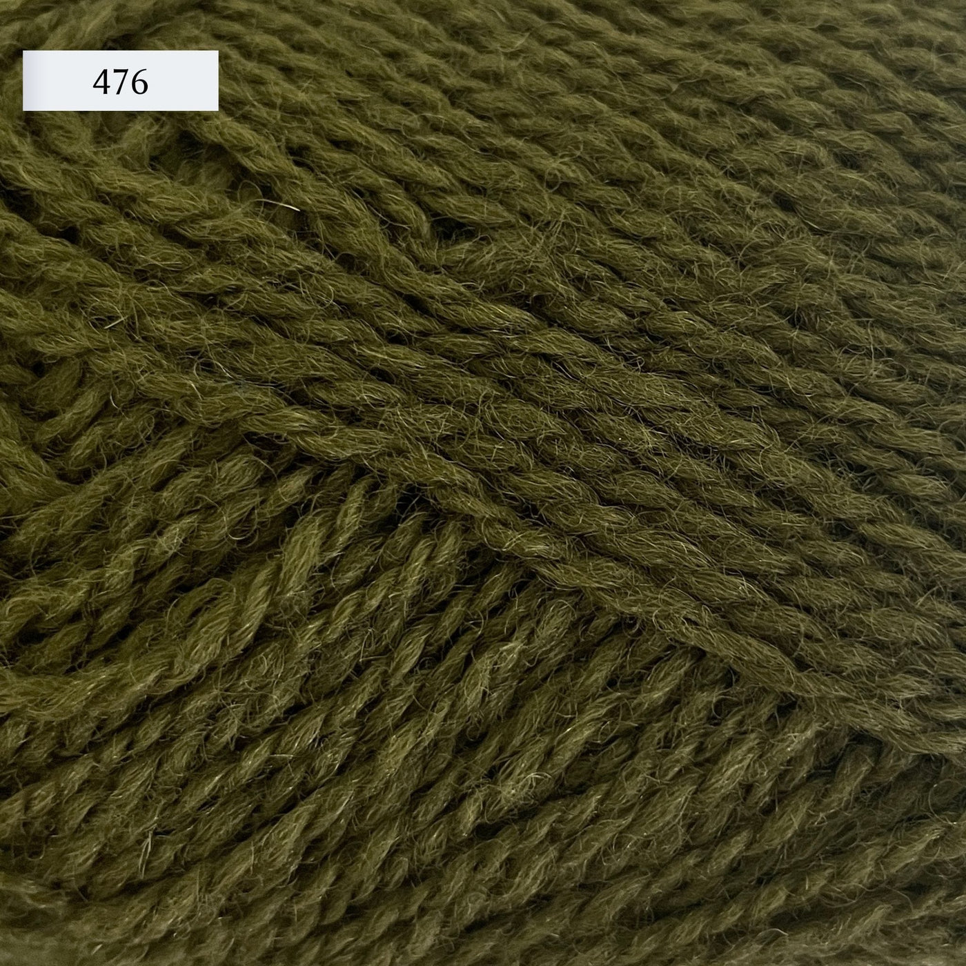 Rauma Finullgarn, a fingering/sport weight yarn, in color 476, a medium army green