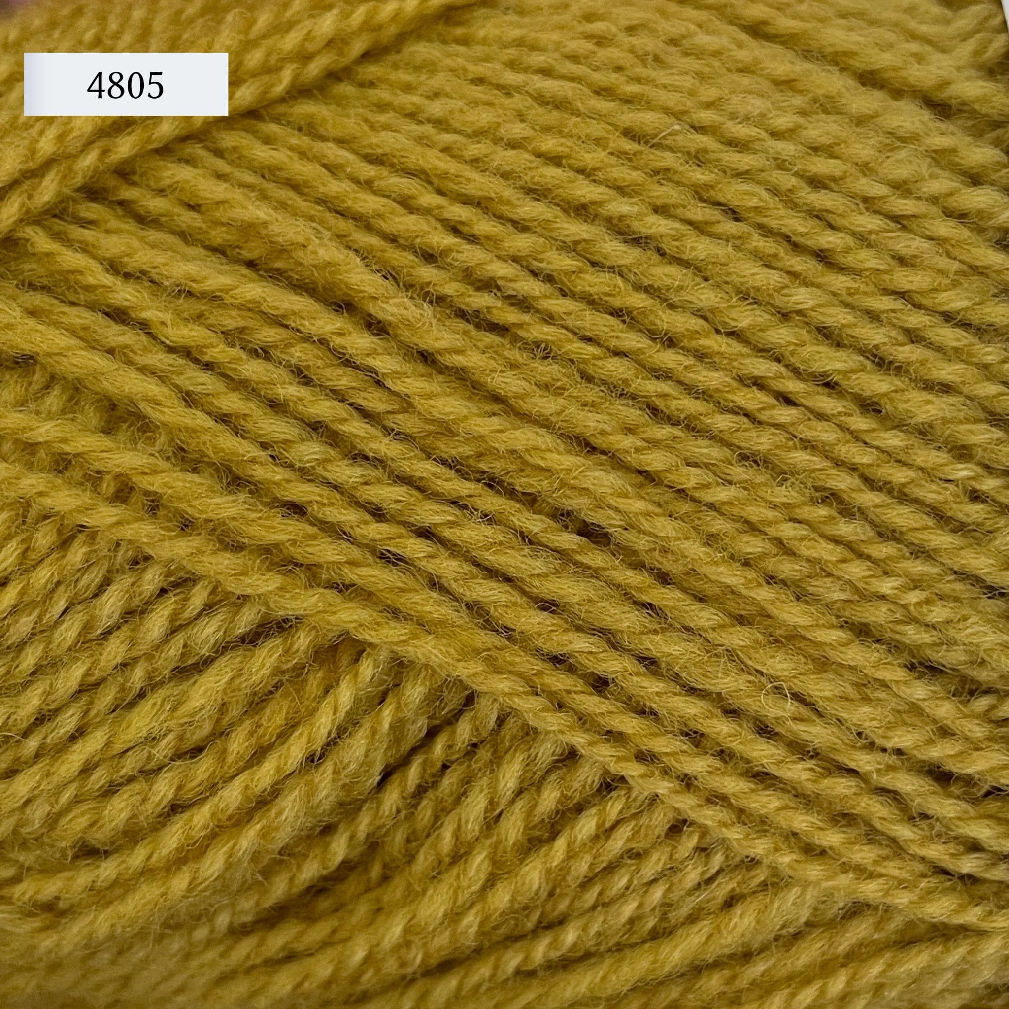 Rauma Gammelserie 2ply wool yarn, fingering weight, in color 4805, a cool yellow gold