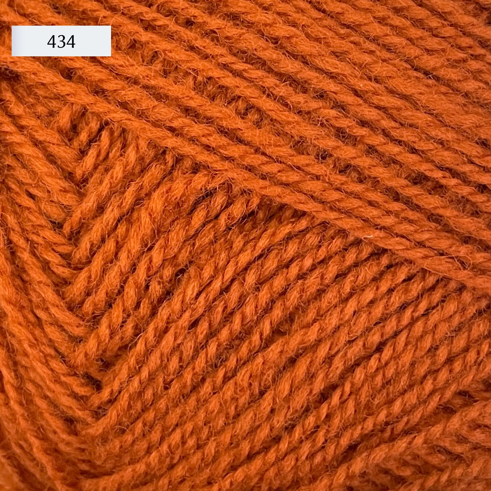 Rauma Gammelserie 2ply wool yarn, fingering weight, in color 434, pumpkin orange
