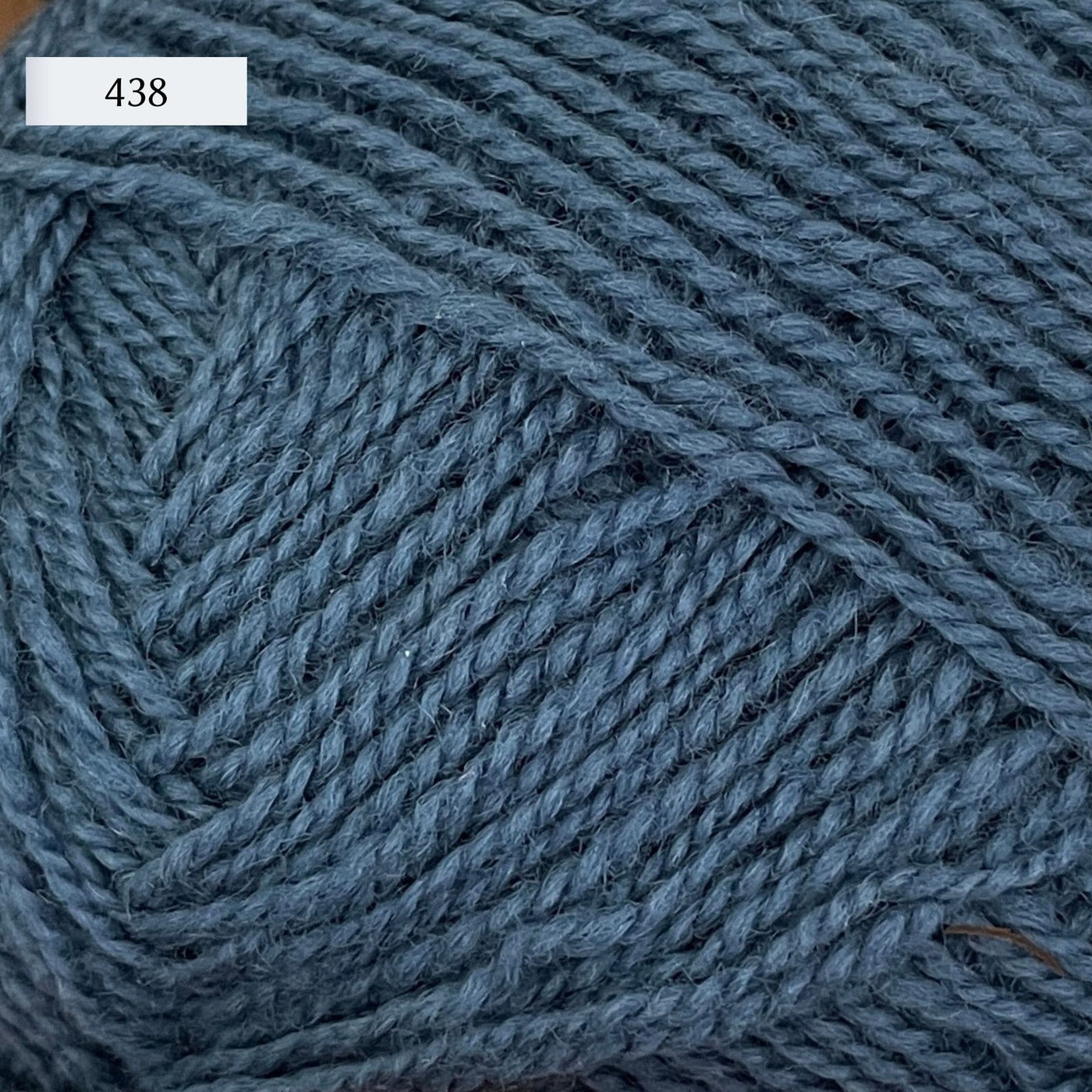 Rauma Gammelserie 2ply wool yarn, fingering weight, in color 438, a cool deep petrol blue