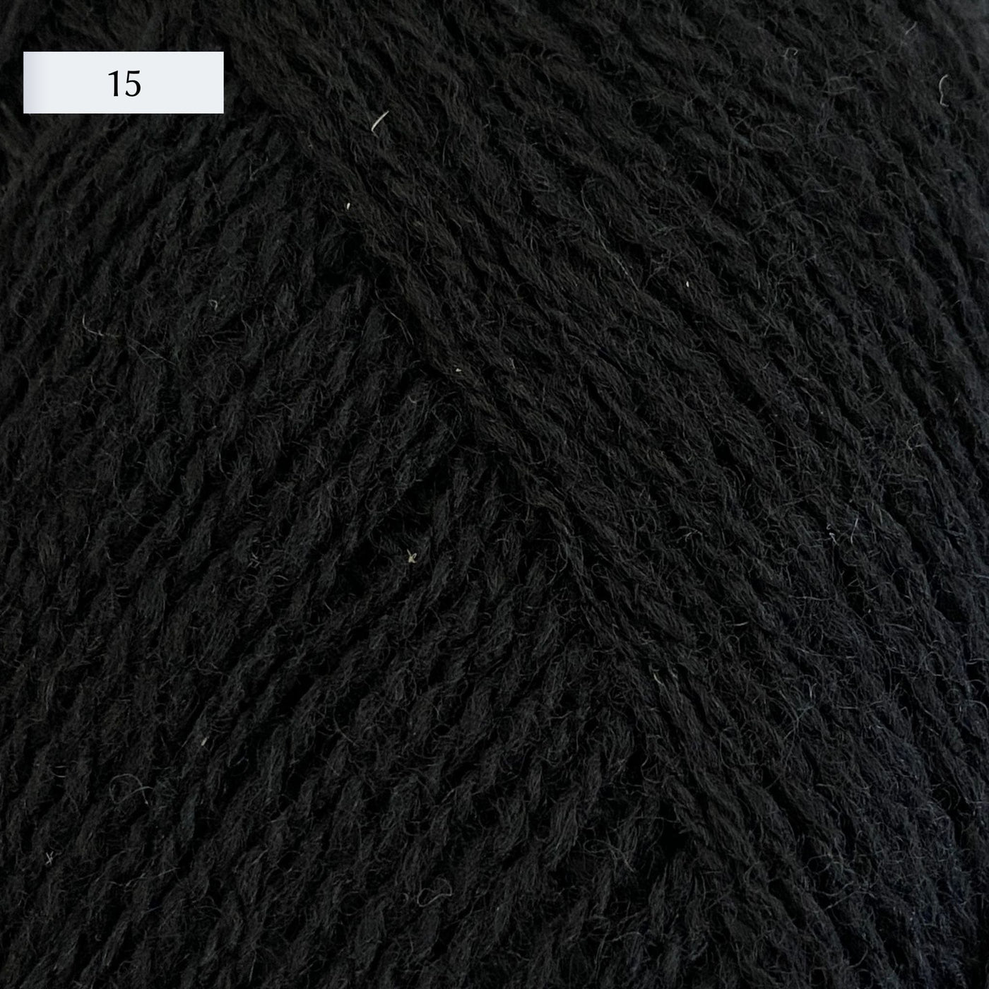 Rauma Lamullgarn, a fingering weight yarn, in color 15, a warm black