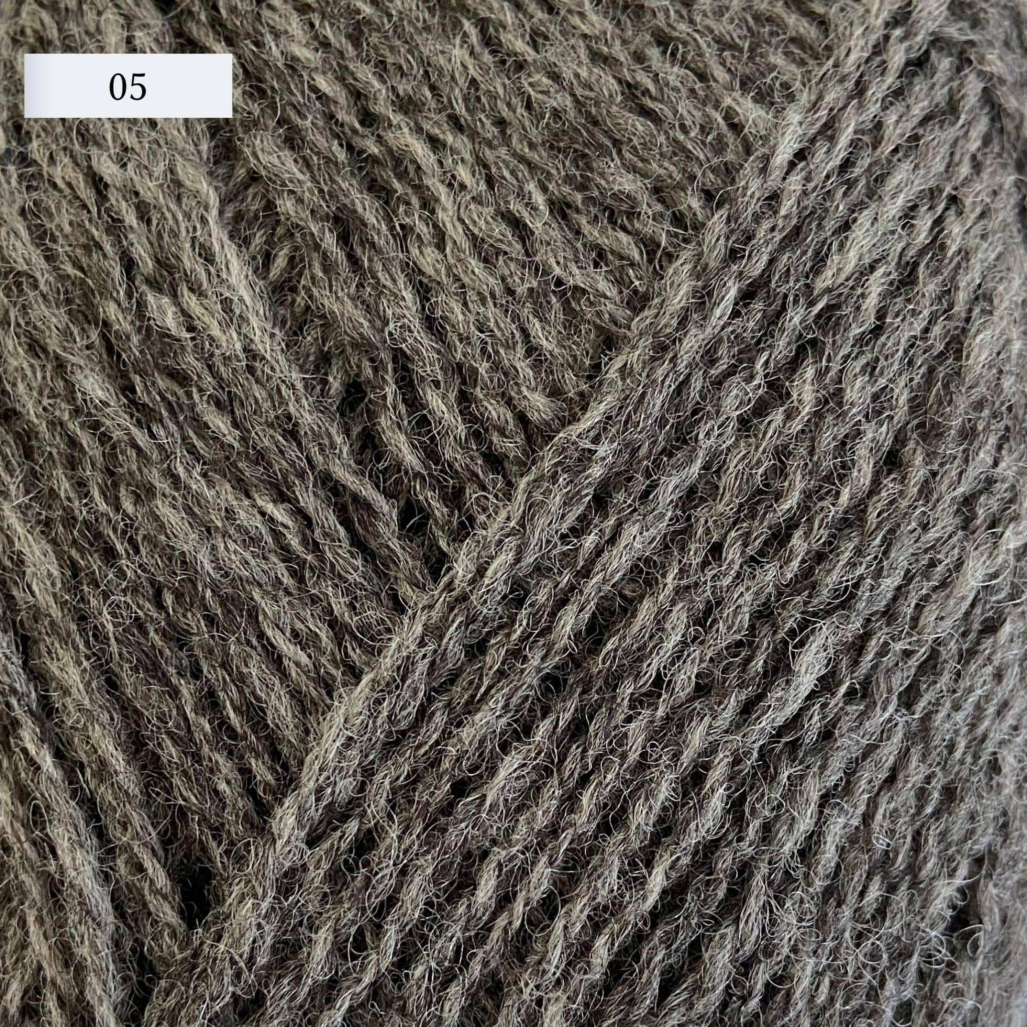 Rauma Lamullgarn, a fingering weight yarn, in color 05, a warm heathered grey
