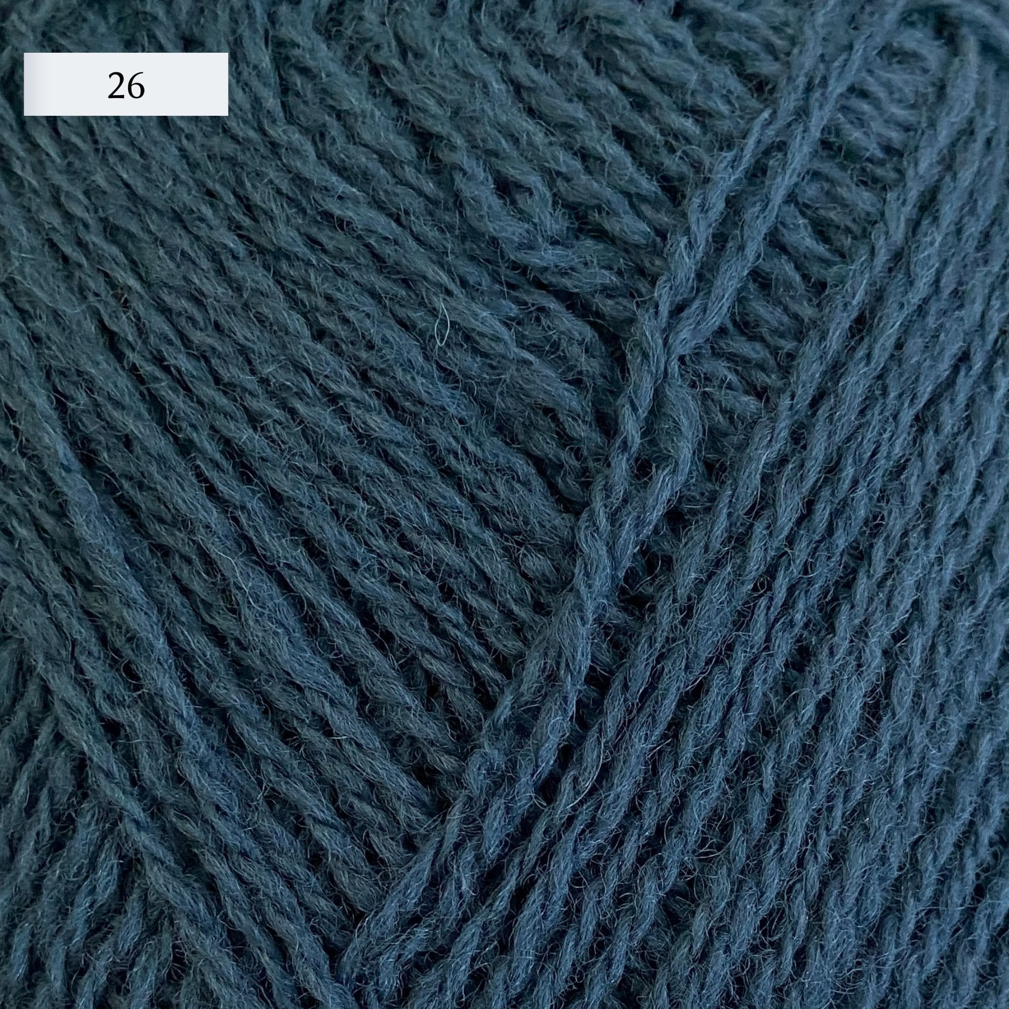 Rauma Lamullgarn, a fingering weight yarn, in color 26, a medium denim blue