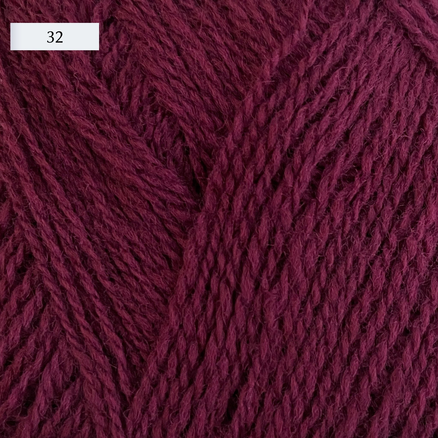 Rauma Lamullgarn, a fingering weight yarn, in color 32, a warm raspberry