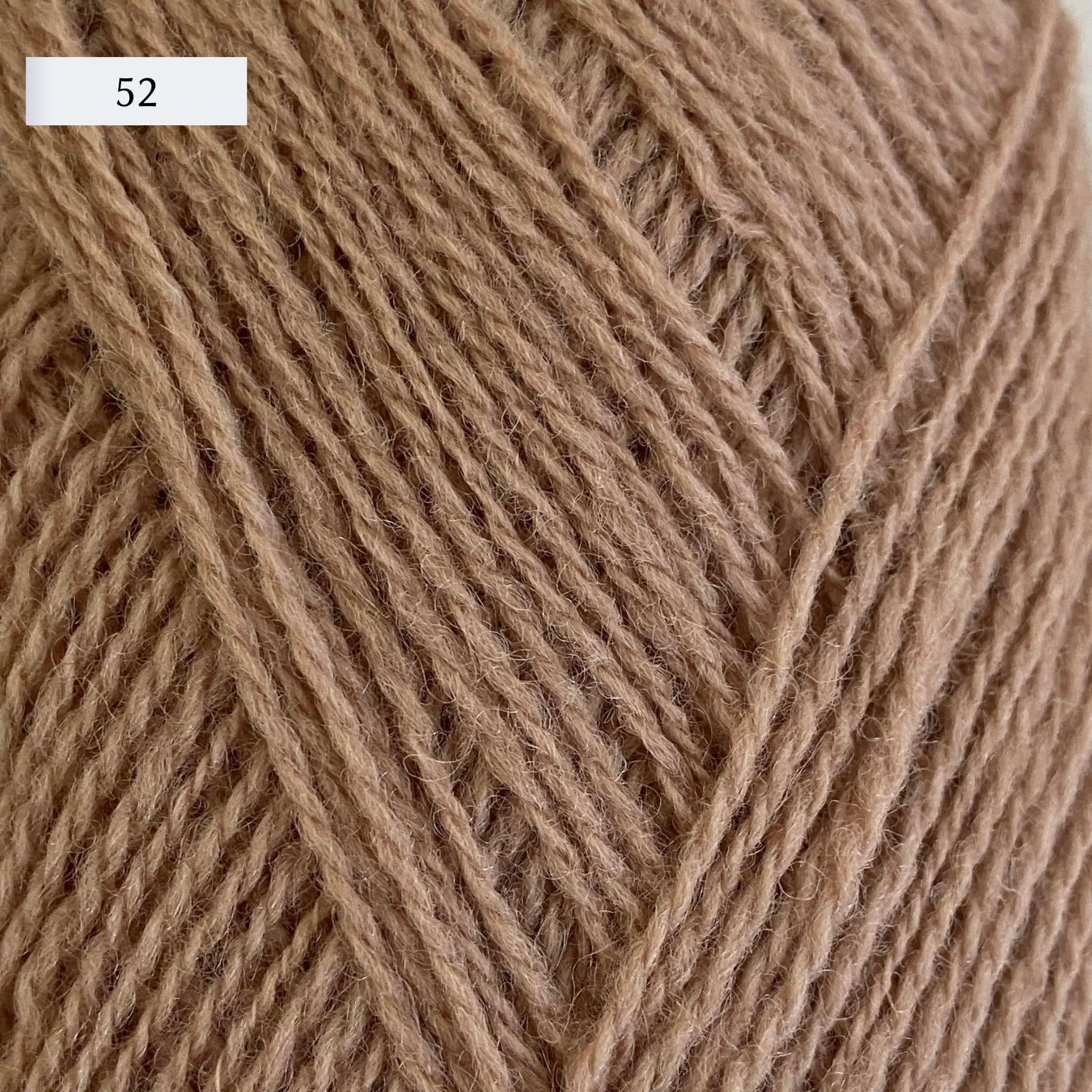 Rauma Lamullgarn, a fingering weight yarn, in color 52, a camel tan