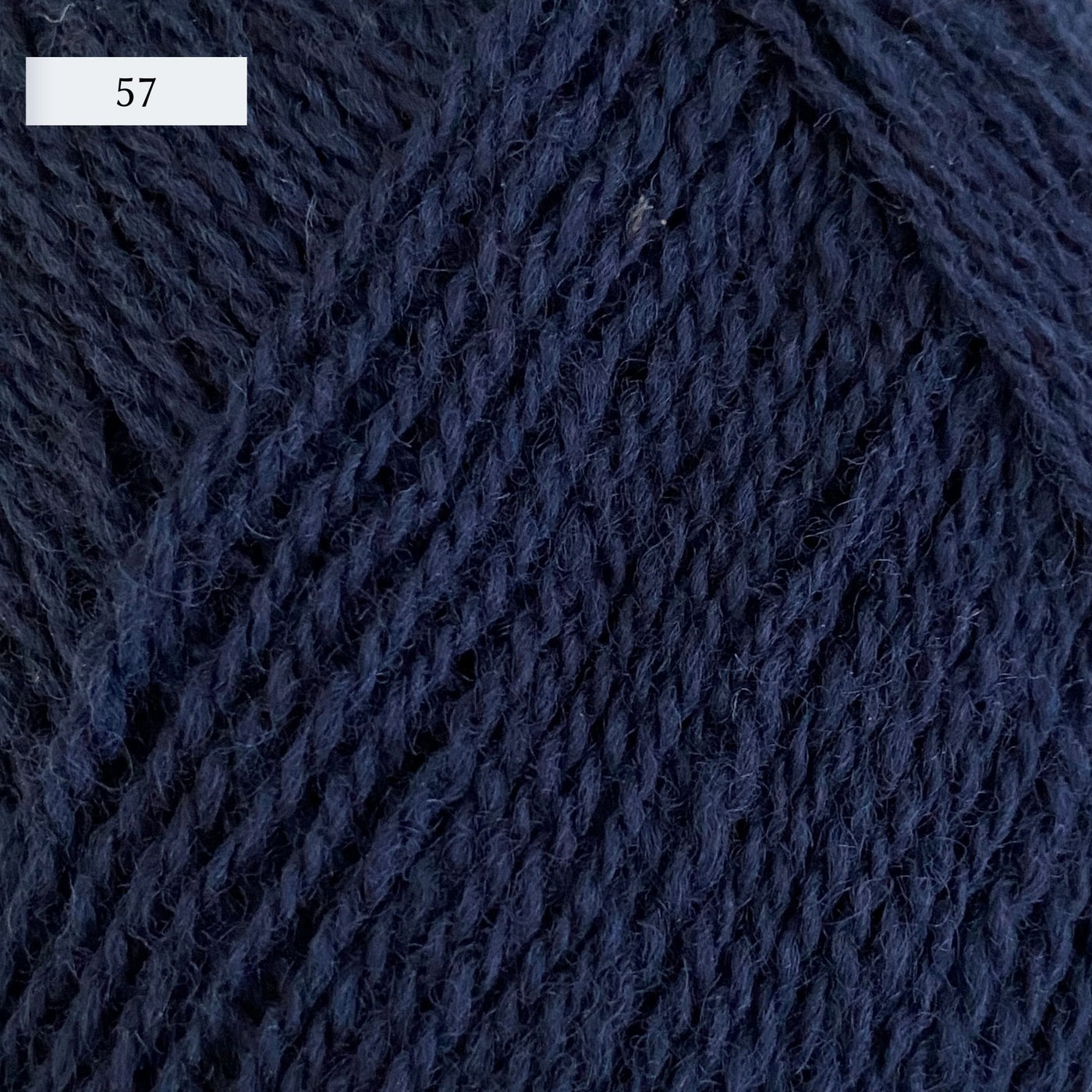 Rauma Lamullgarn, a fingering weight yarn, in color 57, a navy blue