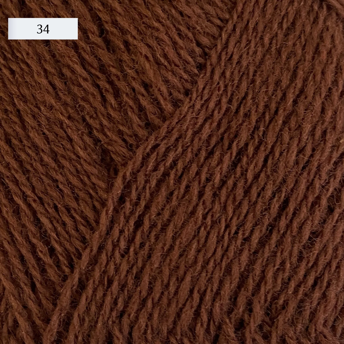 Rauma Lamullgarn, a fingering weight yarn, in color 34, a medium brown