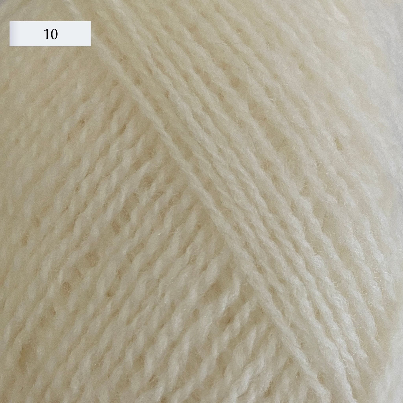 Rauma Lamullgarn, a fingering weight yarn, in color 10, a warm cream natural