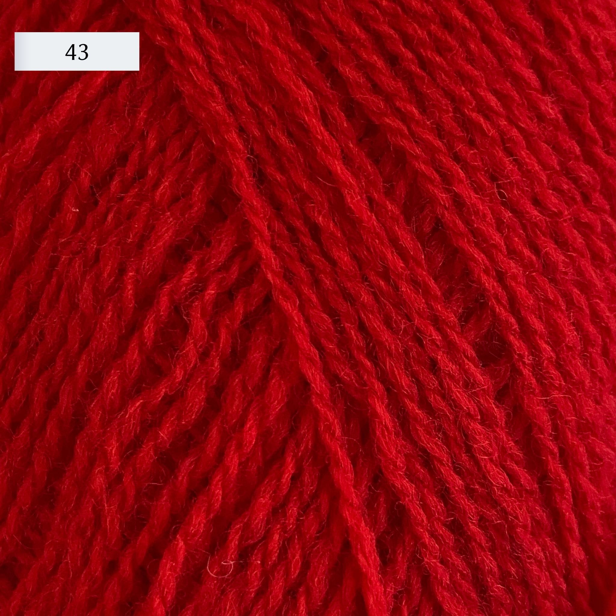 Rauma Lamullgarn, a fingering weight yarn, in color 43, a bright Christmas red