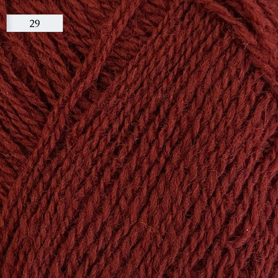 Rauma Lamullgarn, a fingering weight yarn, in color 29, a medium brick red