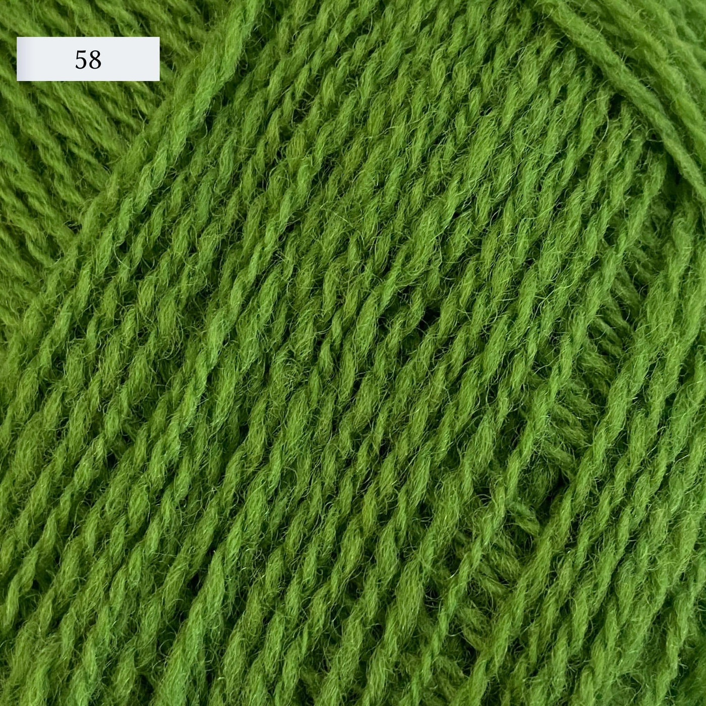 Rauma Lamullgarn, a fingering weight yarn, in color 58, a bright grass green