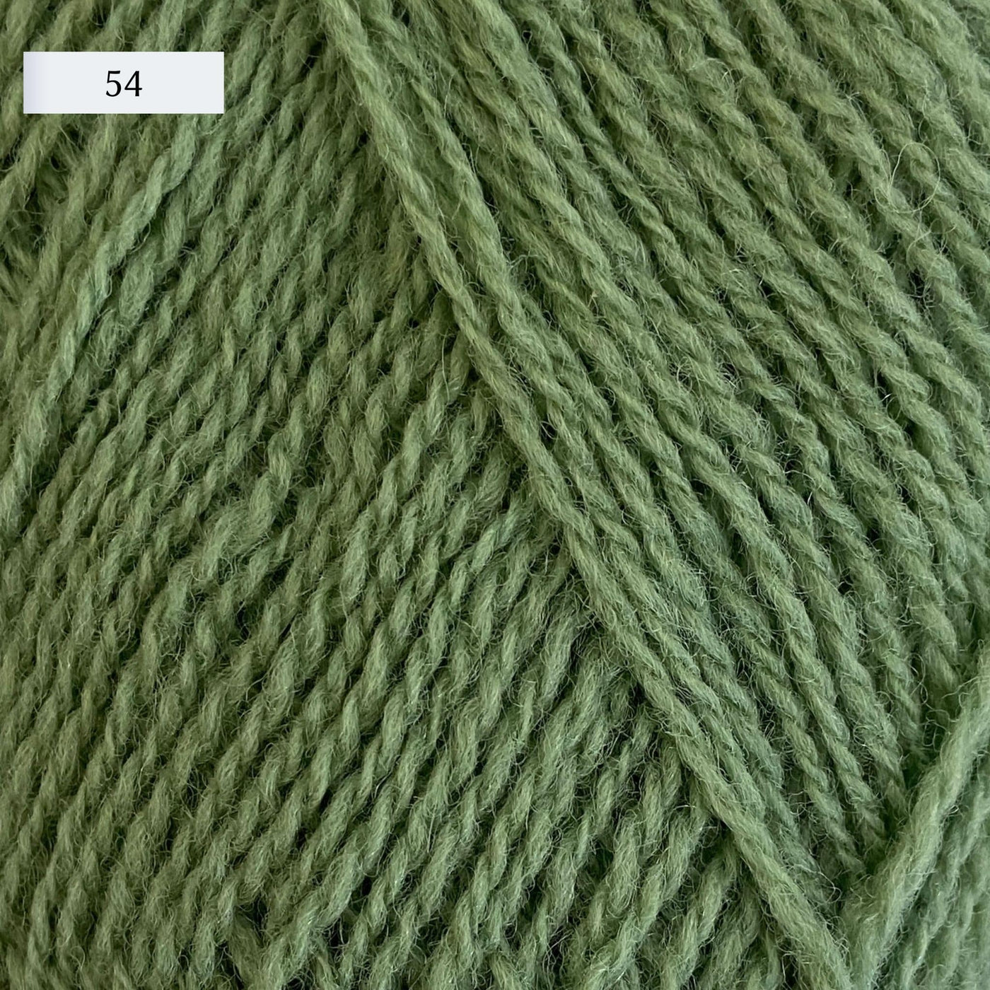 Rauma Lamullgarn, a fingering weight yarn, in color 54, a light cool grass green