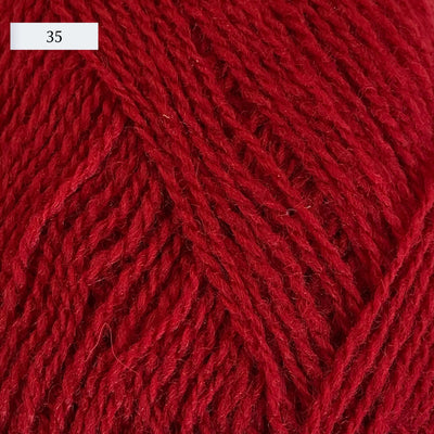 Rauma Lamullgarn, a fingering weight yarn, in color 35, a bright red